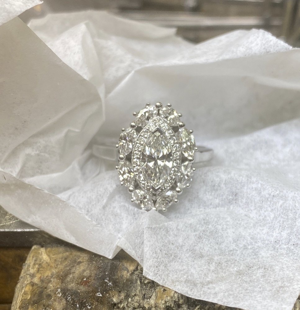 Marquise-cut diamond ring with pavé halo, remounted at the bench